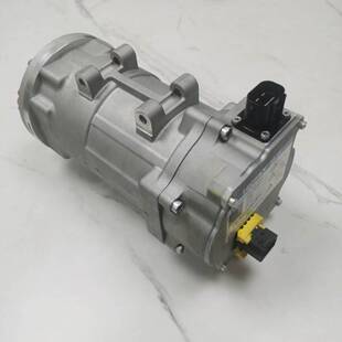 High-voltage electric A/C compressor reference with silver cylindrical housing and yellow connector